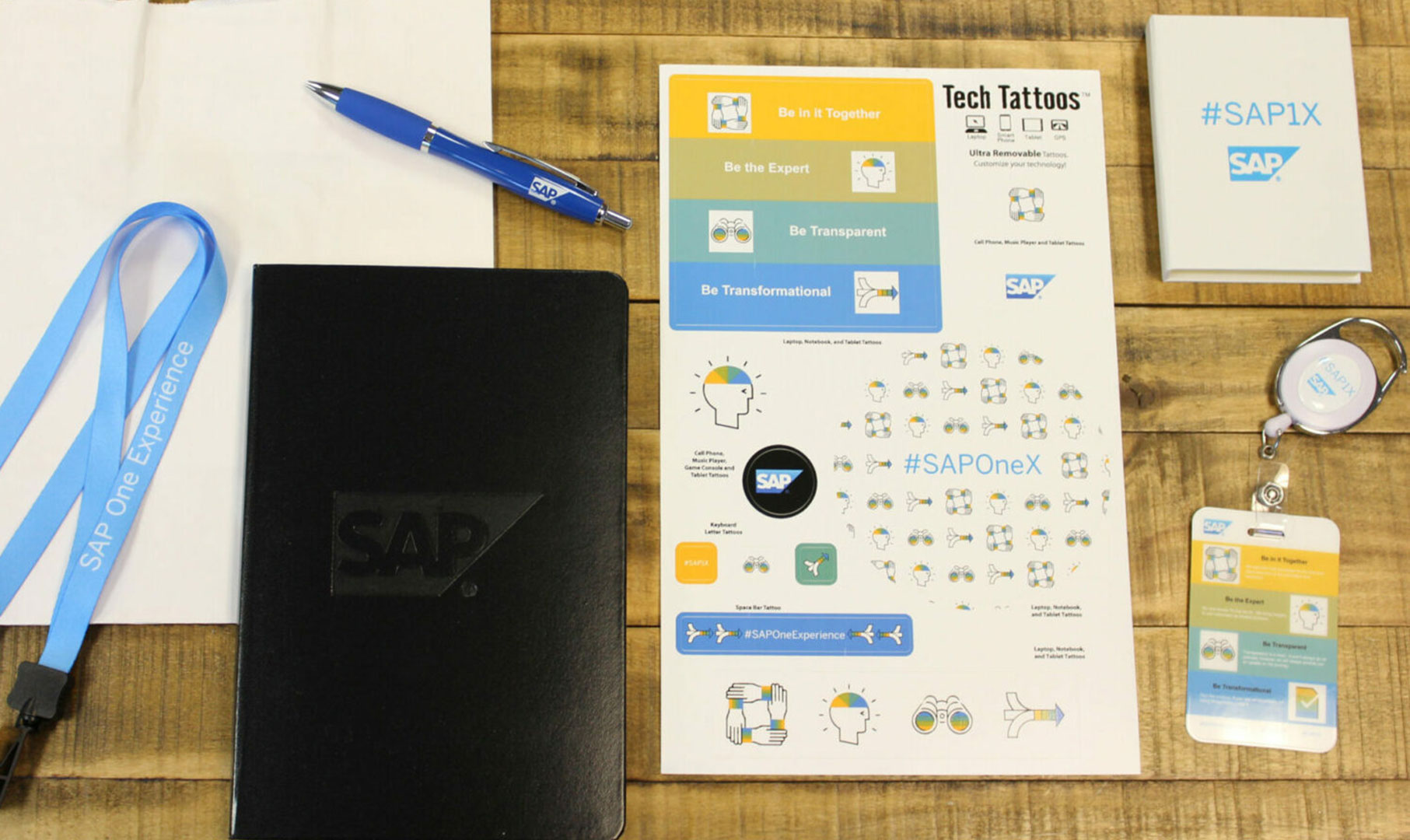 Black journal and a set of stickers with SAP logo on them.