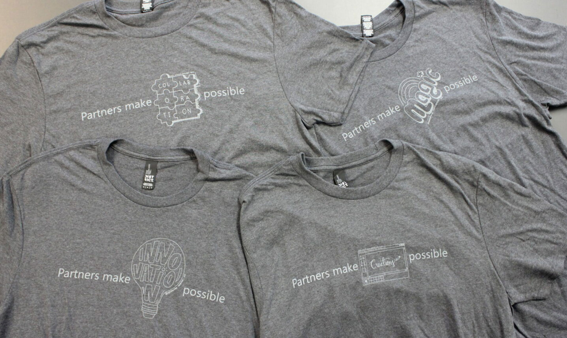 Image of four gray tshirts
