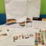 Out at MCB Microsoft Pride 2020 Kits with Hoodie that says pride, two packets of tattoo stickers and face masks.