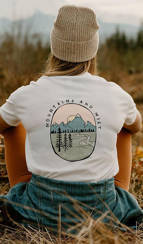 Women Wearing Vie Athletics T-Shirt in an open forest field