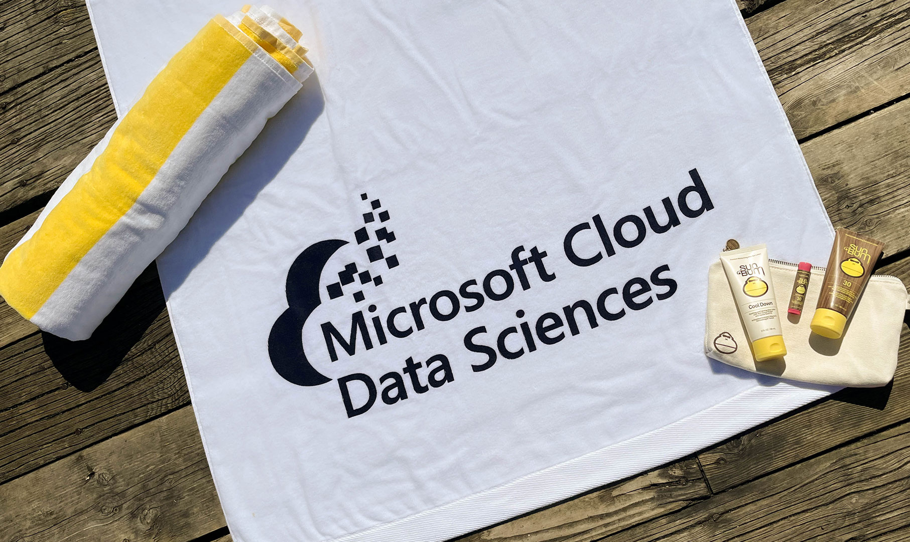 Image of white beach towel with Microsoft Cloud Data Sciences logo
