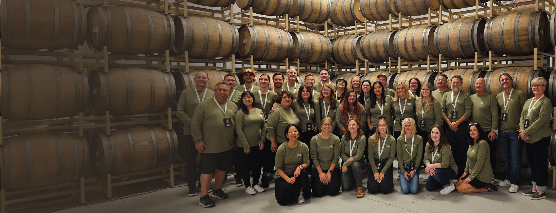 Image Source team employees huddled together for a group photo at Fall Showcase.