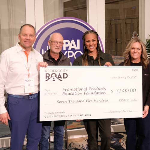 Four people presenting giant promotional check to PPEF