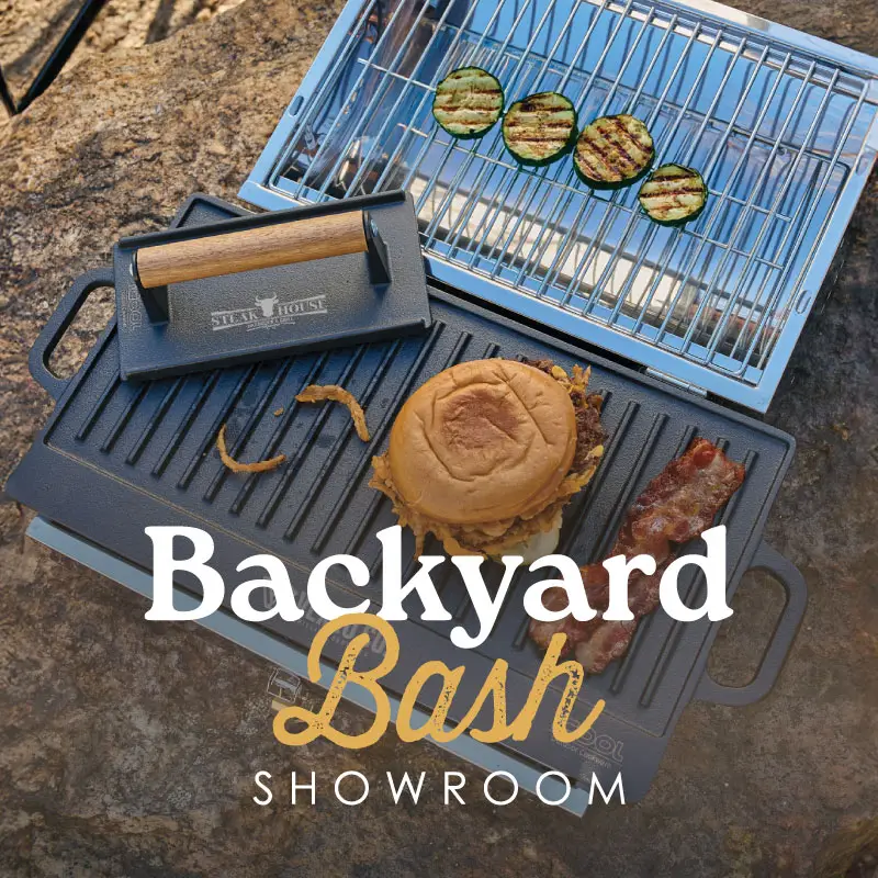 Burgers and veggies on grill.
