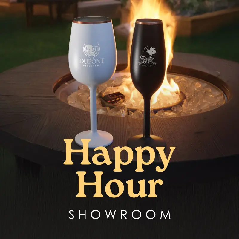 Two wine glass on table by firepit.